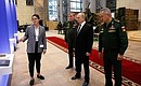 With Chief of the General Staff of the Russian Armed Forces Valery Gerasimov (left) and Defence Minister Sergei Shoigu at the theme exhibition dedicated to the Defence Ministry Board’s final meeting in 2021.