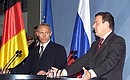 President Vladimir Putin and German Federal Chancellor Gerhard Schroeder at a joint news conference.