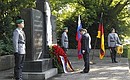 With Federal Chancellor Angela Merkel during ceremony of laying wreath to the monument to the citizens of the USSR and other countries who died in Hannover on April 8, 1945.