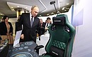 Ahead of the session of the Agency for Strategic Initiatives (ASI) forum, the President toured an exhibition of concepts that won awards at a competition for the best new national brands. Photo: Sergei Savostyanov, TASS