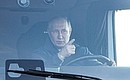 Vladimir Putin arriving at the M-12 Vostok Motorway road service facility behind the wheel of a KamAz truck. Photo: Sergei Bobylev, TASS