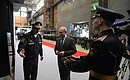 During his visit to the Severnaya Verf Shipyard, Vladimir Putin and Navy veteran, Hero of the Russian Federation Vsevolod Khmyrov attach the storm board to the Admiral Amelko frigate.
