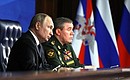 With Chief of the General Staff of the Russian Armed Forces Valery Gerasimov at the expanded meeting of the Defence Ministry Board.