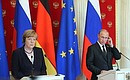 News conference following Russian-German talks. With Federal Chancellor of Germany Angela Merkel.