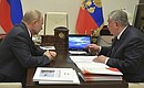 During a meeting with Rosneft CEO Igor Sechin.