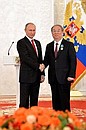 At a ceremony marking National Unity Day, Vladimir Putin presented the Order of Friendship to President of the National Grand Theatre of China Cheng Ping.
