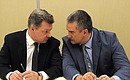 Before a meeting with members of the Crimean Tatar community. Presidential Plenipotentiary Envoy to the Crimean Federal District Oleg Belaventsev (left) and Acting Head of the Republic of Crimea Sergei Aksyonov.