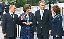 With Lyudmila Putina, British Prime Minister Tony Blair and Cherie Blair before the start of an informal lunch for the G8 heads of state and government and their spouses.