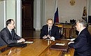 President Putin at meeting with the Director of the Federal Security Service Nikolai Patrushev (left) and the Head of the Border Service of the FSB Vladimir Pronichev.