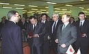 Vladimir Putin and Japanese Prime Minister Yoshiro Mori visiting the Russian-Japanese joint venture NEK-Neva Communications Systems.