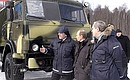 At the scientific research for testing and development of automobile equipment (Central vehicle testing ground). On the President\'s left is KamAZ Chief Designer Denis Valeyev, and on his right is KamAZ General Director Sergei Kogogin.