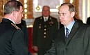 Mr Putin presented the epaulets of fleet admiral to Vladimir Kuroyedov.