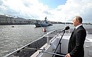 Navy Day celebrations. Aboard a motor boat Vladimir Putin inspected Navy combat ships and greeted service personnel on Navy Day.