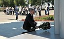 Laying flowers at a monument to paratroopers killed in the performance of their duty.
