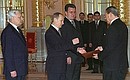 Colombian Ambassador Miguel Santamaria Davila (right) presenting his credentials to President Putin.