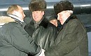 President Vladimir Putin with Tyumen Governor Sergei Sobyanin and Alexander Filippenko, Governor of the Khanty-Mansi Autonomous Region, to the right, at the airport during the greeting ceremony.