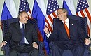 President Vladimir Putin with US President George Bush.