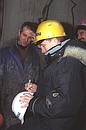 Vladimir Putin at a drilling tower.