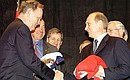 President Putin and Jean Chretien receive 2002 T-shirts of Canadian and Russian Olympic ice hockey select teams.