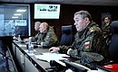 Vladimir Putin, together with Defence Minister Sergei Shoigu, left, and Chief of the General Staff of the Russian Armed Forces and First Deputy Defence Minister Valery Gerasimov, observed the main stage of the Vostok-2022 strategic command post exercise at the Sergeyevsky range in the Primorye Territory.