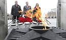 Sergei Ivanov and Acting Governor of Tula Region Alexei Dyumin lay flowers at the Eternal Flame at the Heroic Defenders of Tula memorial.