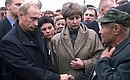 Vladimir Putin with relatives of the sailors from the Kursk nuclear submarine.