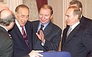 President Vladimir Putin with Ukrainian President Leonid Kuchma, in the centre, and Azeri President Heydar Aliyev before an expanded meeting of the CIS Council of Heads of State.