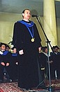 At a ceremony of receiving the gown of honorary member of the law department\'s academic council.