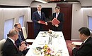 Russian Railways CEO Oleg Belozerov and China Railway Corporation General Manager Lu Dongfu sign a memorandum on organising rapid and high-speed trans-border rail freight transit on the China-Russia-Europe route.