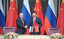 During the signing of Russian-Chinese documents. With President of China Xi Jinping.