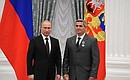 Presenting Russian Federation state decorations. The Order of Friendship is awarded to Ural Asbestos Mining and Processing Plant mine excavator operator Sergei Ufimtsev.