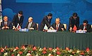 Signing documents adopted at the Shanghai Cooperation Organisation summit. 