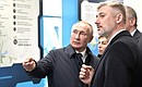 Vladimir Putin familiarizes himself with the information on the development of transport infrastructure in the south of Russia, in particular the Crimean Railway. With Transport Minister Yevgeny Ditrikh.