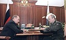 President Putin with Deputy Minister of Internal Affairs Andrei Chernenko, head of the Federal Migration Service.