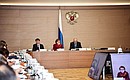 Deputy Chief of Staff of the Presidential Executive Office Magomedsalam Magomedov, right, at the meeting of the Russian Academy of Education Board of Trustees.