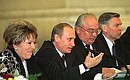 President Putin with Deputy Prime Minister Valentina Matvienko, left, Moscow State University Rector Viktor Sadovnichy and Education Minister Vladimir Filippov, right, at the 7th congress of the Russian Rectors\' Union.