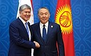 Президент Киргизии Алмазбек Атамбаев и Президент Казахстана Нурсултан Назарбаев перед началом заседания Совета глав государств – членов Шанхайской организации сотрудничества.