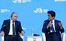 With Prime Minister of Japan Shinzo Abe at the Eastern Economic Forum plenary session. Host Photo Agency
