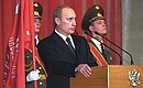 President Putin speaking at an official meeting dedicated to Defender of the Fatherland Day.