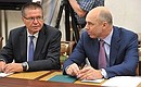 Before the beginning of the meeting on developing the United Aircraft Corporation. Economic Development Minister Alexei Ulyukaev (left) and Finance Minister Anton Siluanov.