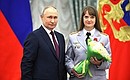 The medal of the Order for Services to the Fatherland, II degree is presented to Olesya Loskutova, deputy head of the Main Information Analysis Centre at the Russian Ministry of the Interior, lieutenant colonel of the internal service. Photo: Mikhail Tereshenko, TASS