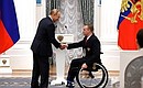 Presenting state decorations to winners of the 2020 Summer Paralympic Games in Tokyo. Andrei Granichka, swimming champion and silver medallist of the Paralympics, receives the Order of Friendship. Photo: RIA Novosti