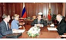 President Putin with Security Council Secretary Sergei Ivanov, to the left, Vladimir Kalamanov, Presidential Envoy for Human Rights and Freedoms in Chechnya, and Ella Pamfilova, member of the Public Commission on Human Rights in Chechnya.