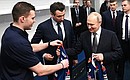 Vladimir Putin was given an ice hockey uniform during his visit to SKA Arena multi-purpose concert and sports complex. With First Vice-President of the Russian Hockey Federation, head coach of HC SKA Roman Rotenberg (second left). Photo: Pavel Bednyakov, RIA Novosti