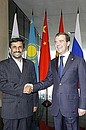With President of Iran Mahmoud Ahmadinejad before the start of the Shanghai Cooperation Organisation Council of Heads of State meeting in restricted format attended by heads of SCO observer countries. 