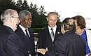 President Vladimir Putin with members of the Enlarged Dialogue at the G8 Summit, including UN Secretary-General Kofi Annan (second from left) and Algerian President Abdelaziz Bouteflika (right foreground).