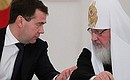 With Patriarch Kirill of Moscow and All Russia at a meeting with participants of the Bishops' Council.