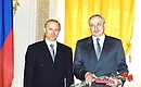 Russian Minister of Science and Technology Mikhail Kirpichnikov receiving the 1999 State Science and Technology Prize.