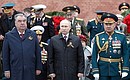 Wreath-laying ceremony at Tomb of Unknown Soldier. With President of Tajikistan Emomali Rahmon and Defence Minister Sergei Shoigu (right).