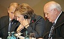 With German Chancellor Angela Merkel and Russian Chairman of the Petersburg Dialogue Forum Russian Coordinating Council Mikhail Gorbachev.